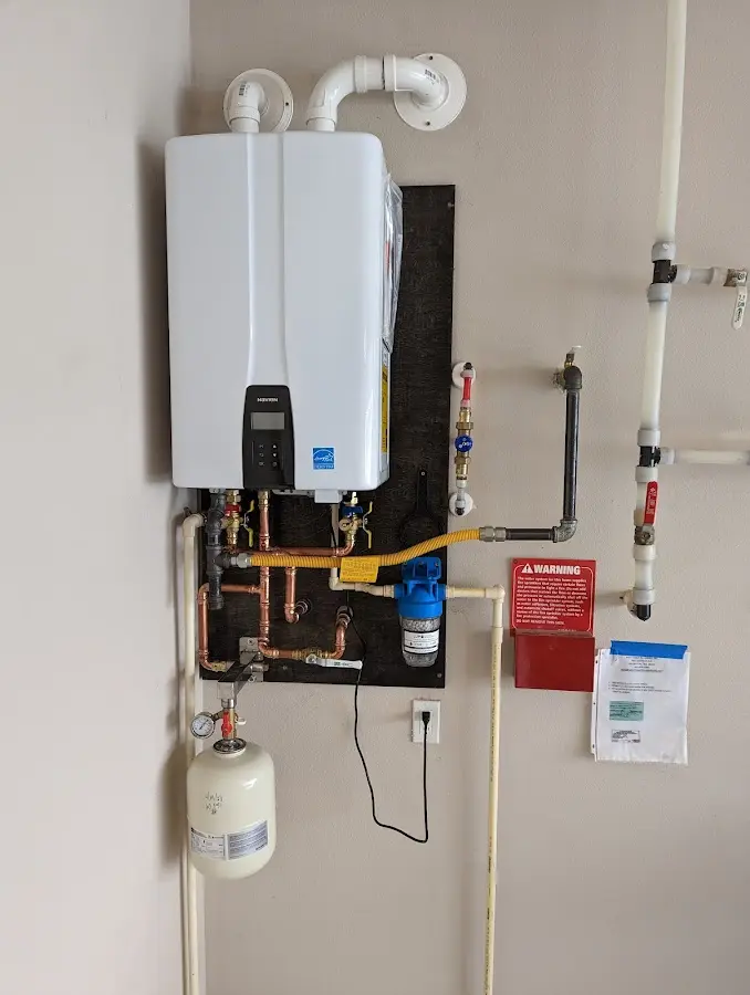 Professional plumber installing copper piping in a Vicksburg home